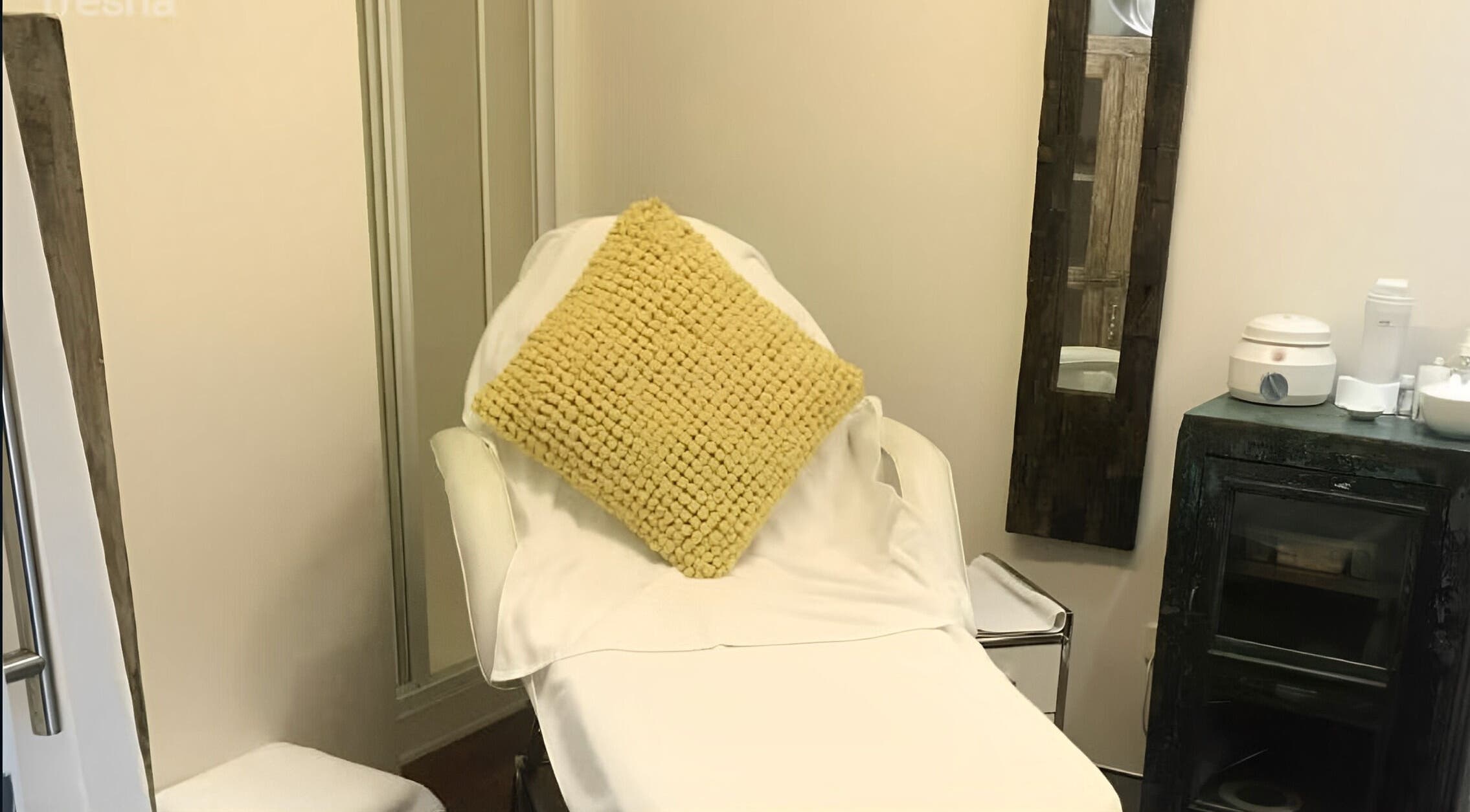 Relaxing treatment nook at Studio Vogue Salon, Baringa, Queensland, AU with a comfy chair and mirror.