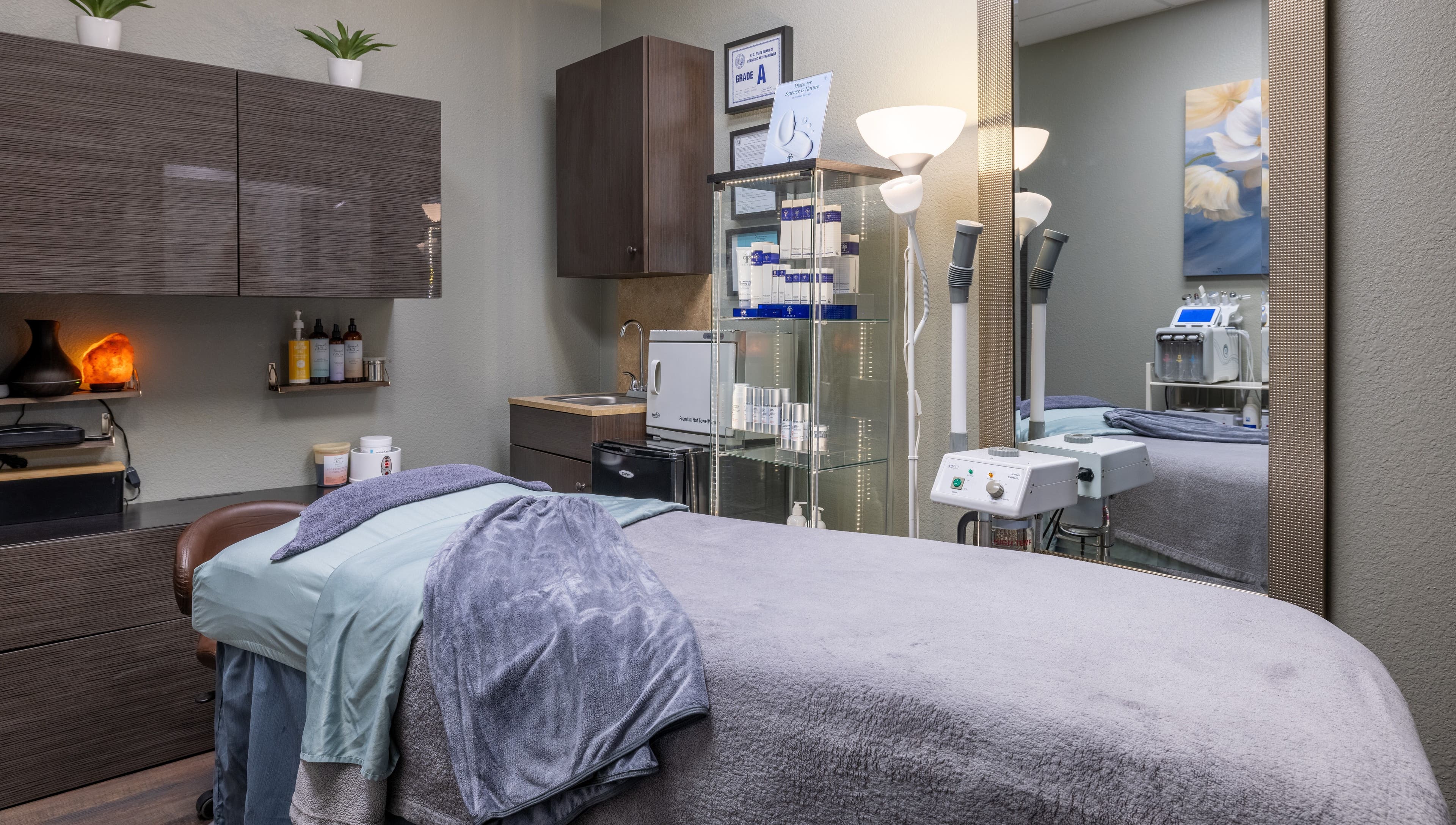 Cozy treatment room at Sweet Serenity Spa in Charlotte, North Carolina, US, featuring relaxation bed and equipment.