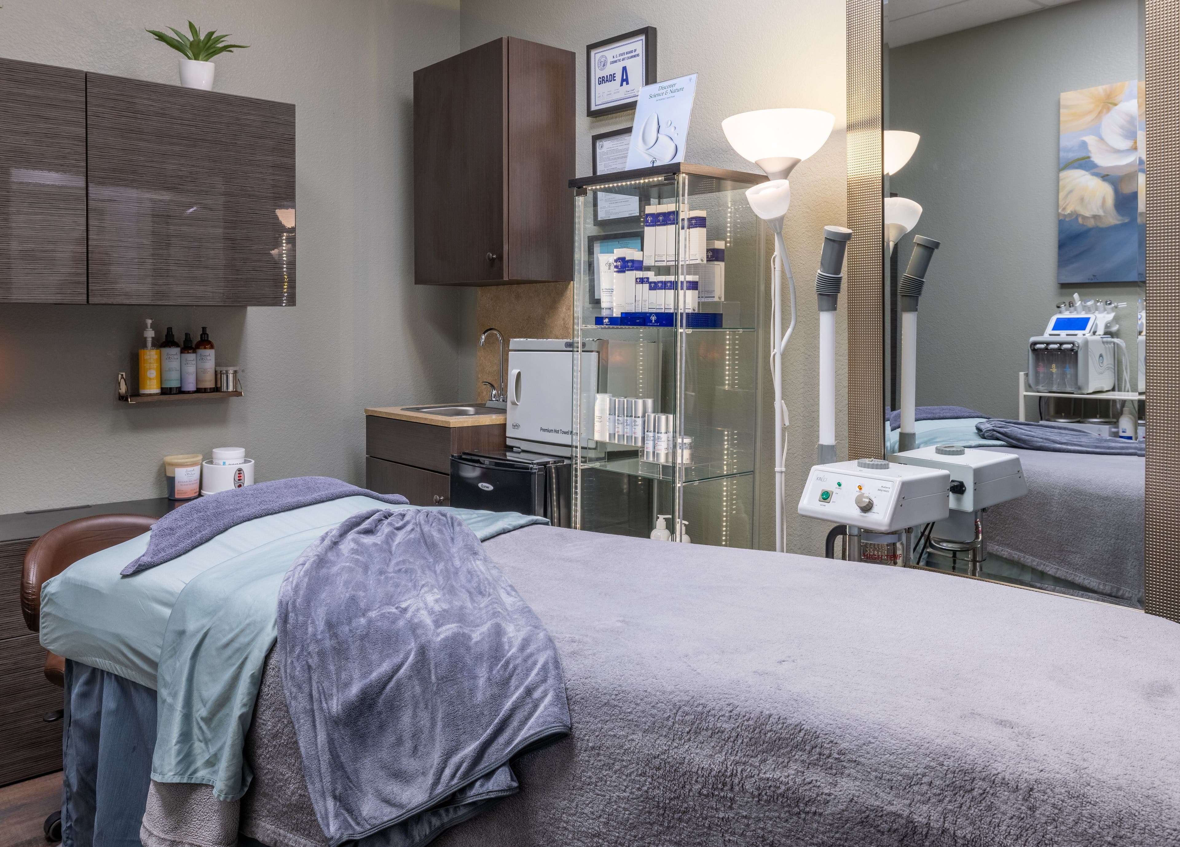 Cozy treatment room at Sweet Serenity Spa in Charlotte, North Carolina, US, featuring relaxation bed and equipment.
