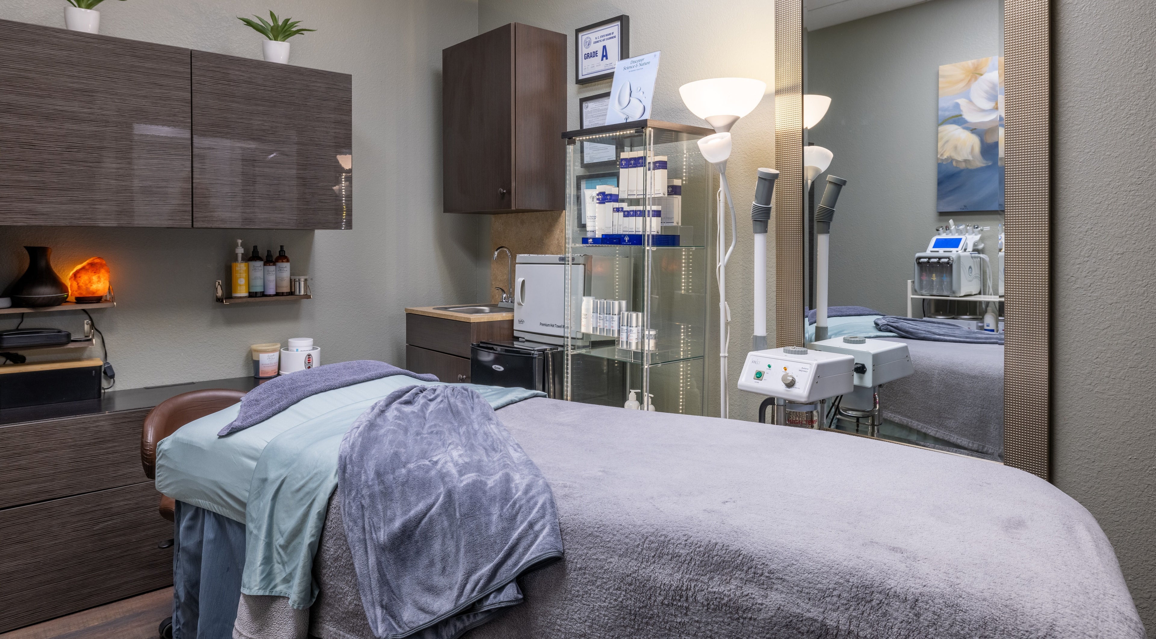Cozy treatment room at Sweet Serenity Spa in Charlotte, North Carolina, US, featuring relaxation bed and equipment.