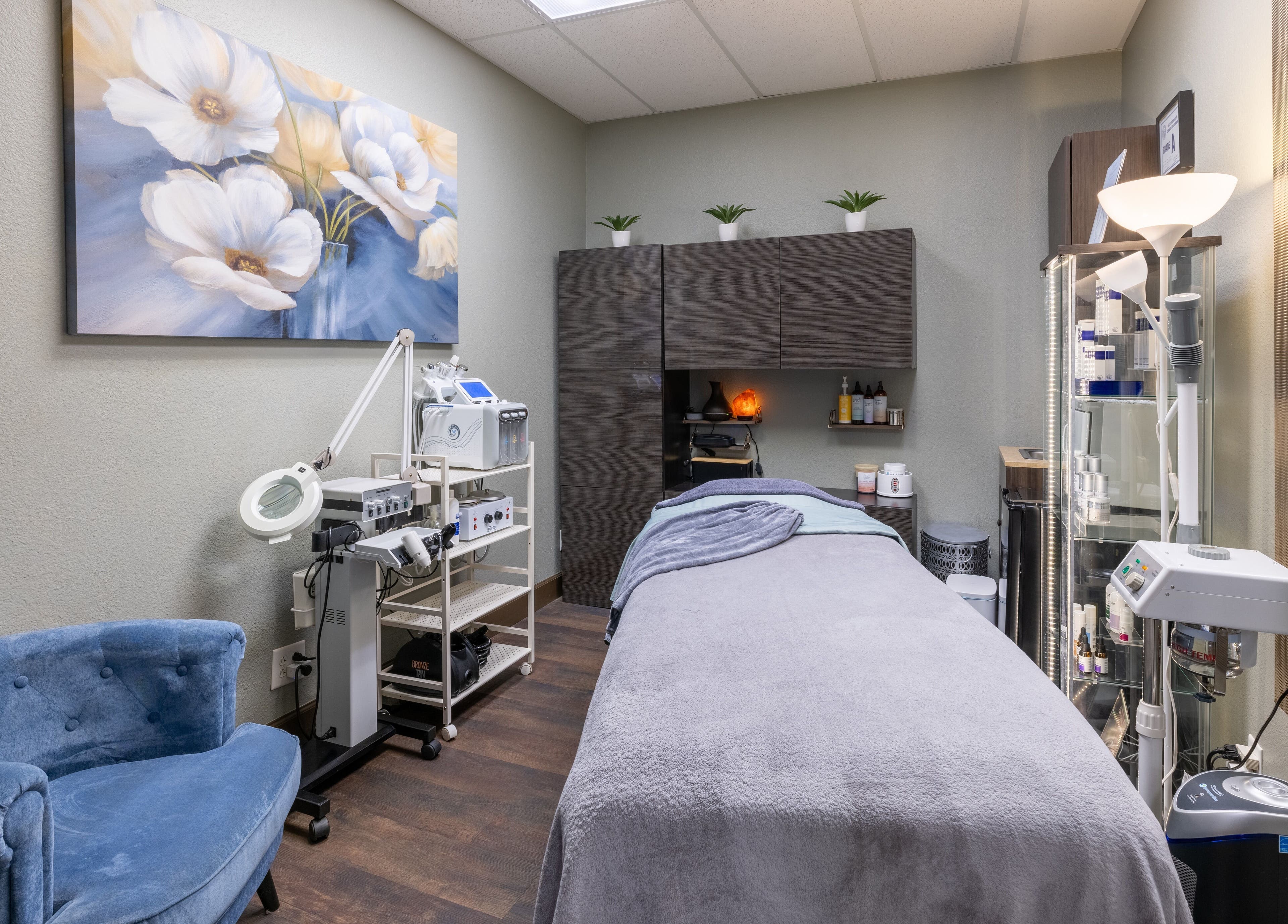 Calm treatment room at Sweet Serenity Spa, Charlotte, North Carolina, US, featuring a plush blue chair.