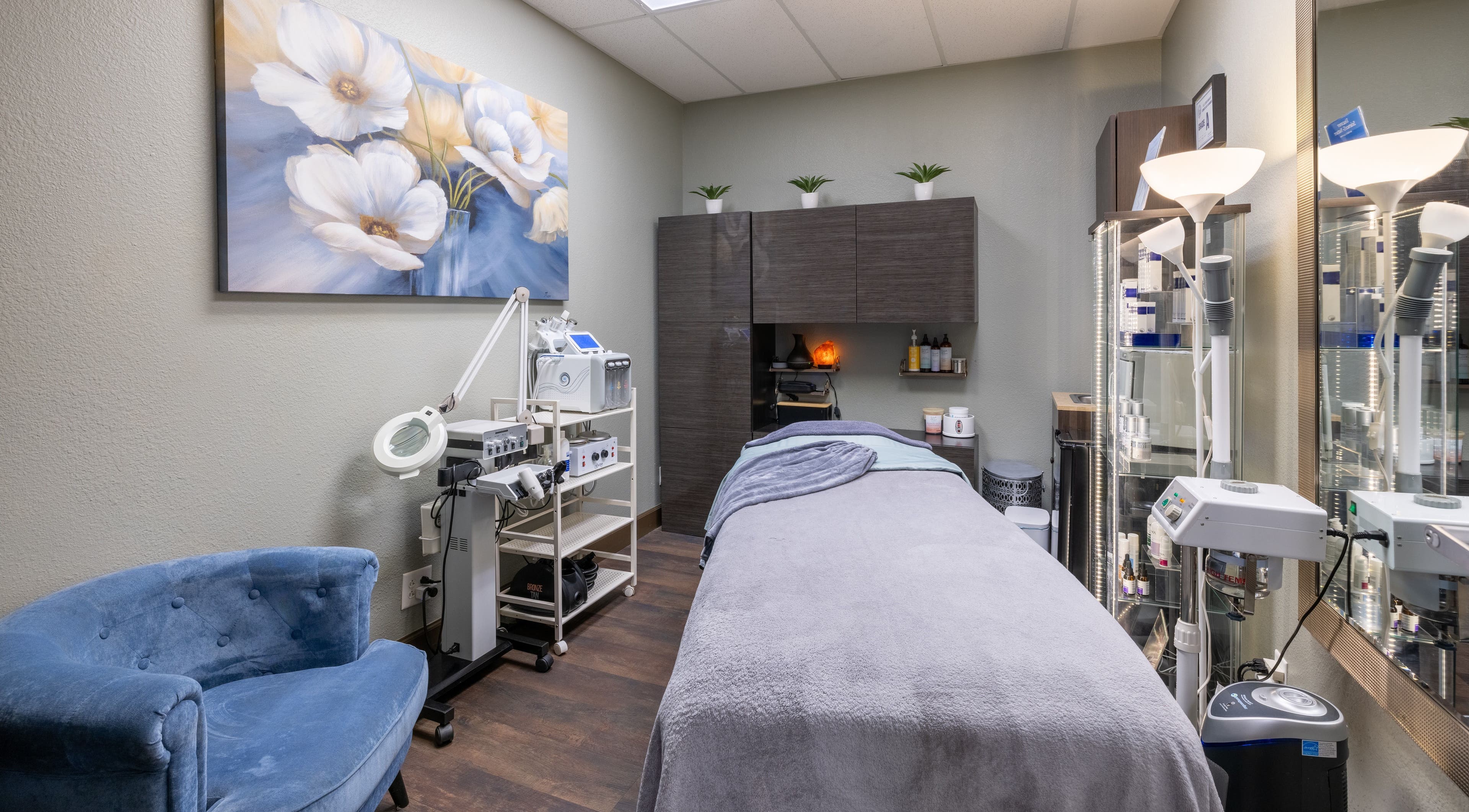 Calm treatment room at Sweet Serenity Spa, Charlotte, North Carolina, US, featuring a plush blue chair.
