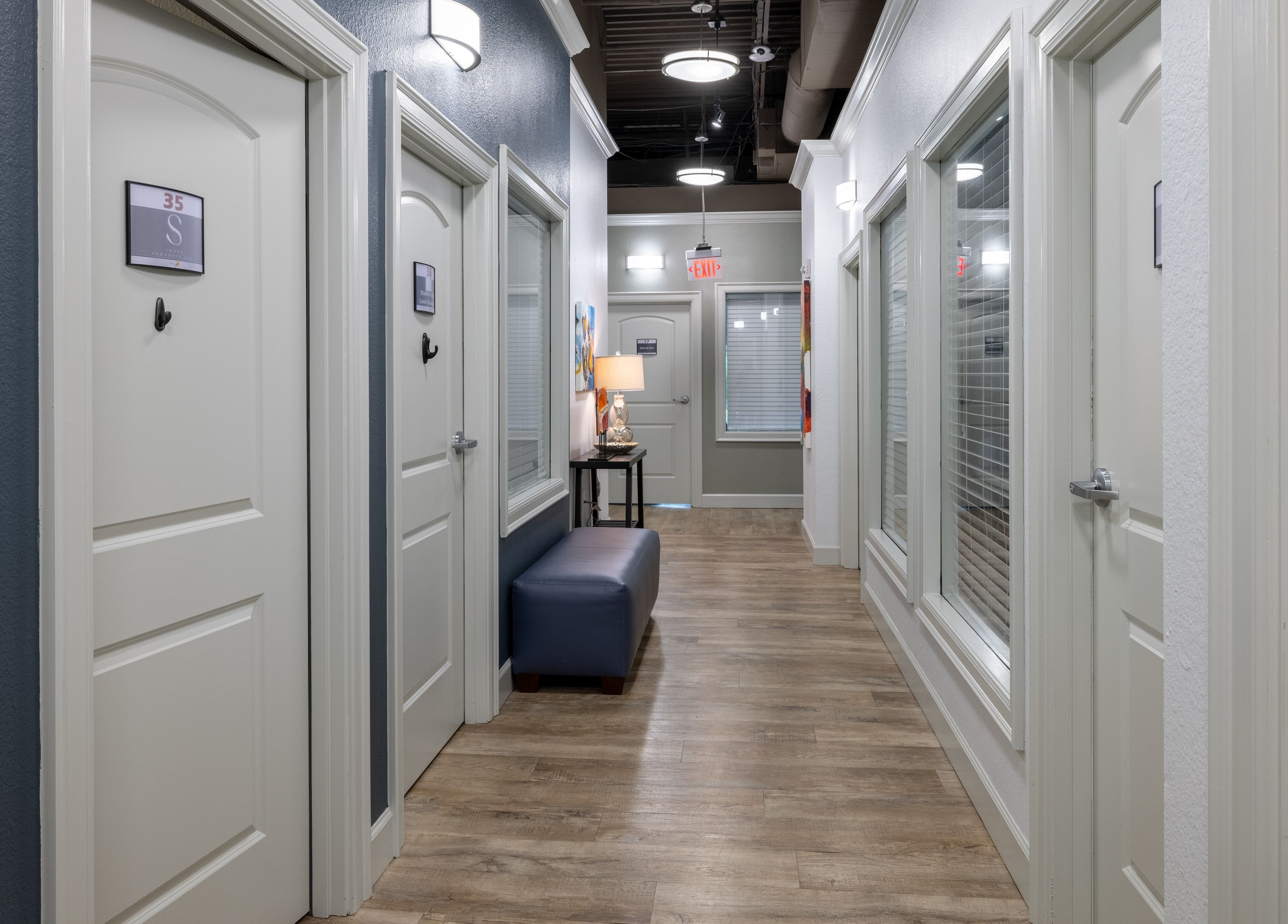 Elegant hallway at Sweet Serenity Spa, Charlotte, North Carolina, US, featuring soft lighting and stylish decor.