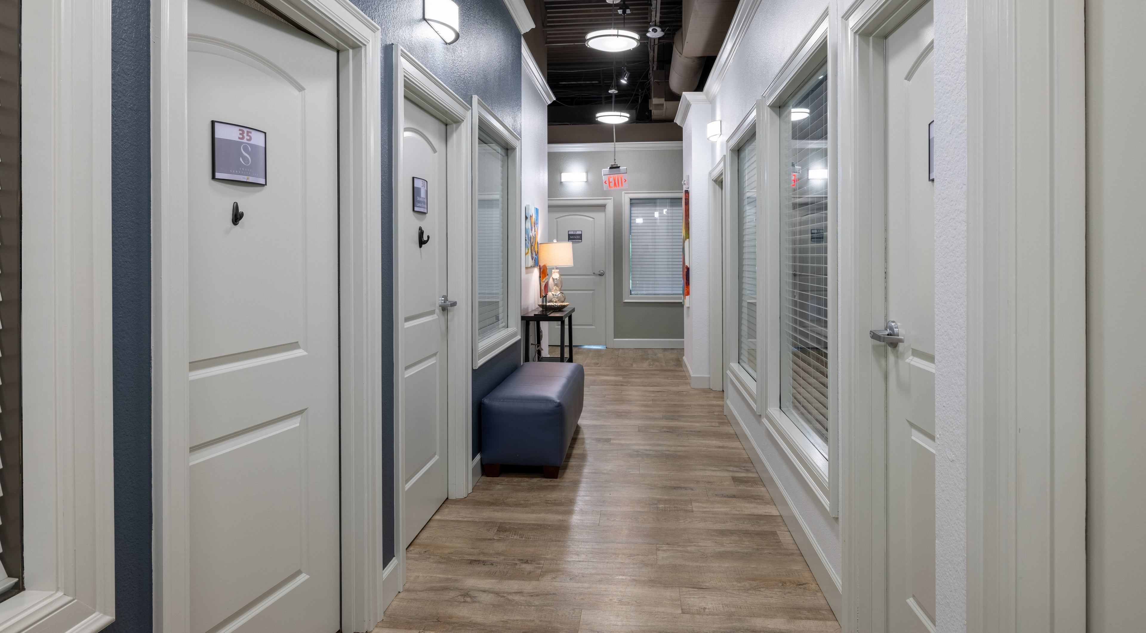 Elegant hallway at Sweet Serenity Spa, Charlotte, North Carolina, US, featuring soft lighting and stylish decor.