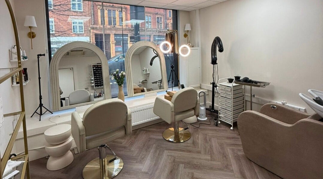 Interior of Blonde Studio London in London, England, GB with elegant mirrors and chic salon chairs.