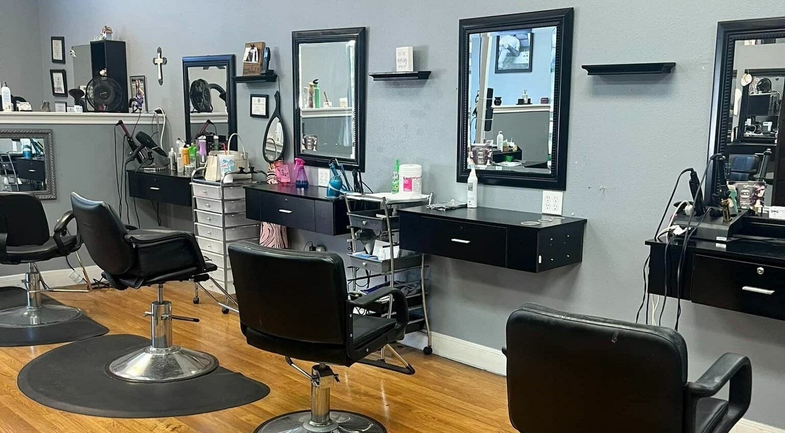 Interior of Beautify Me Hair and Lash Spa in Kingwood, Texas, US showing modern salon chairs and mirrors.