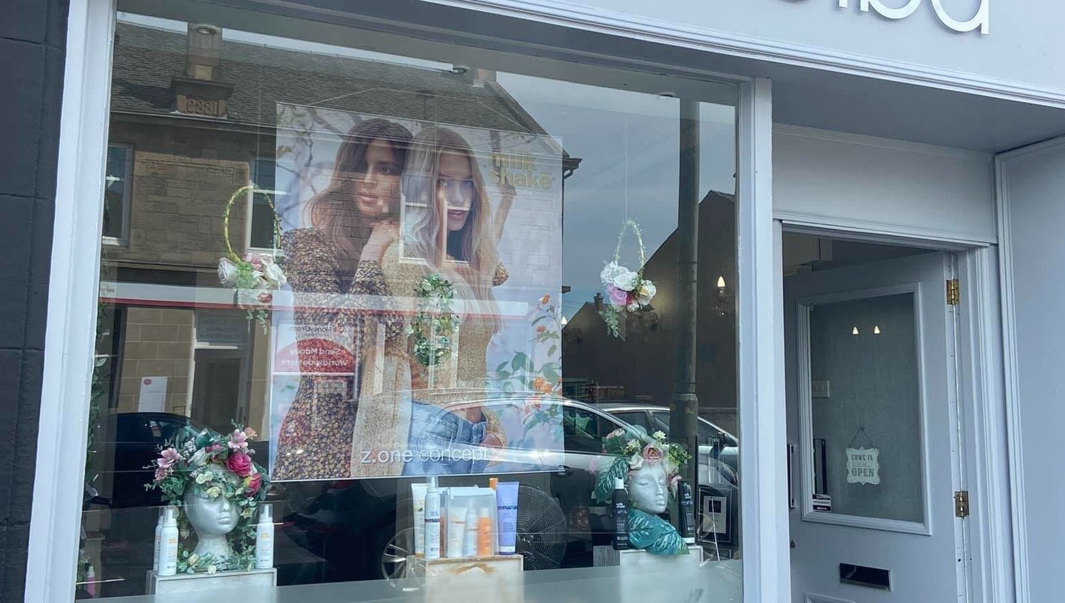 Front window of Hair By Shannyn at Salon Biba, Larbert, Scotland, GB with elegant decorations.