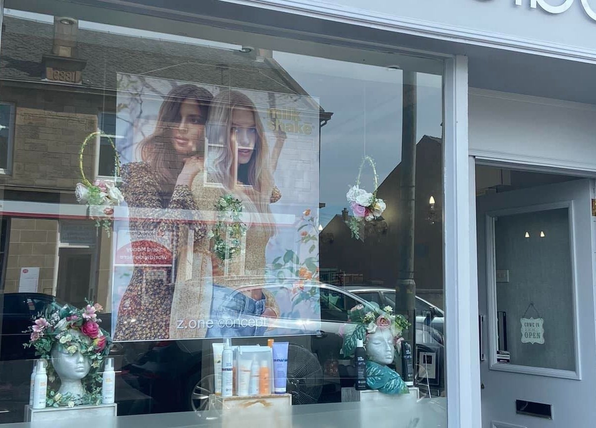 Front window of Hair By Shannyn at Salon Biba, Larbert, Scotland, GB with elegant decorations.