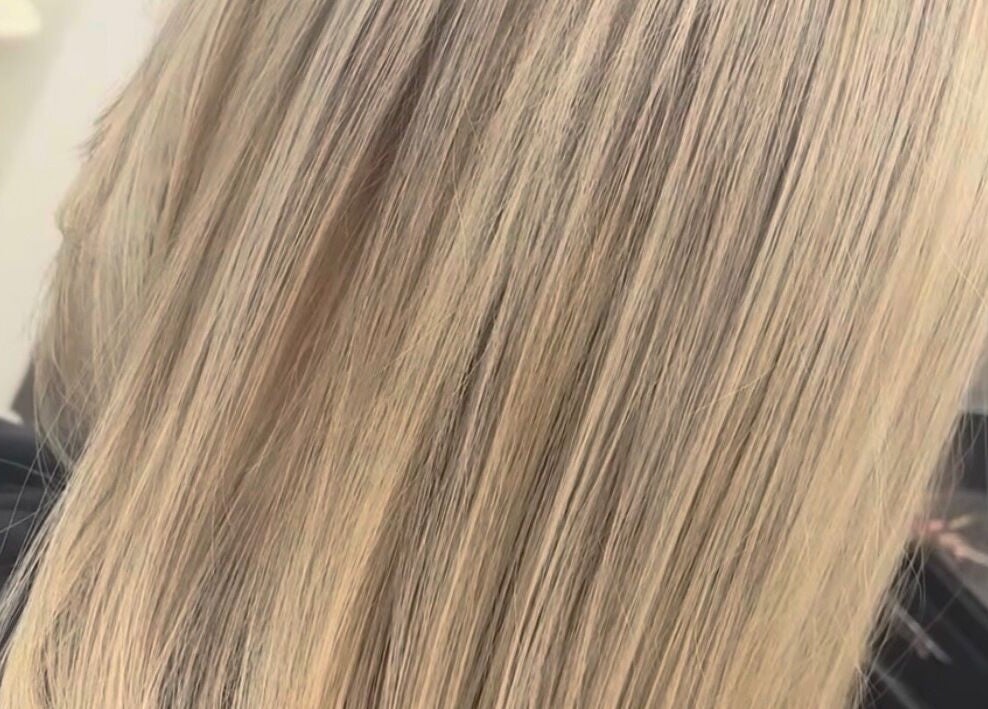 Shiny blonde hair styled at Hair By Shannyn at Salon Biba, Larbert, Scotland, GB.
