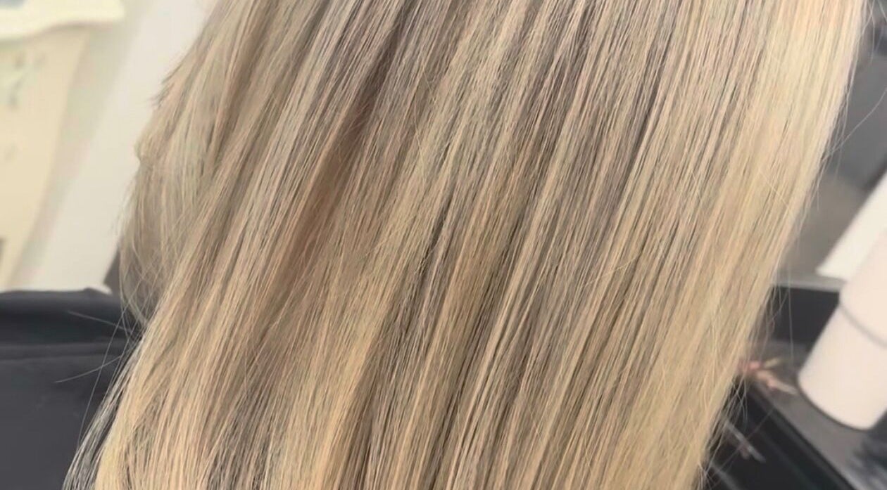 Shiny blonde hair styled at Hair By Shannyn at Salon Biba, Larbert, Scotland, GB.