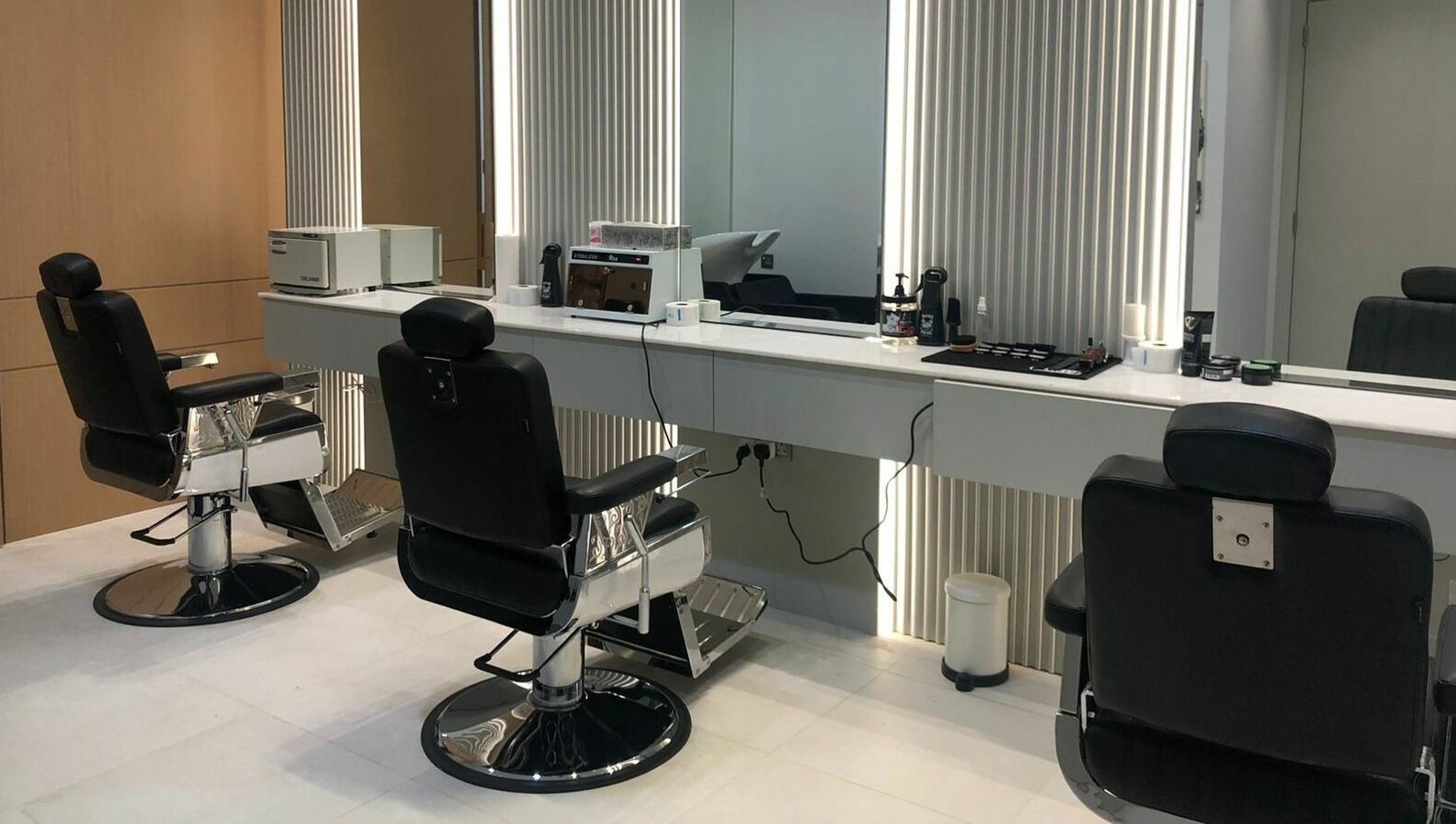 Modern barbershop chairs and elegant mirrors at Ok Gents Salon, دبي, دبي, AE.