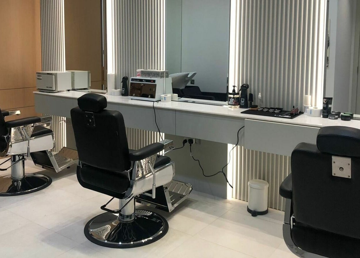Modern barbershop chairs and elegant mirrors at Ok Gents Salon, دبي, دبي, AE.