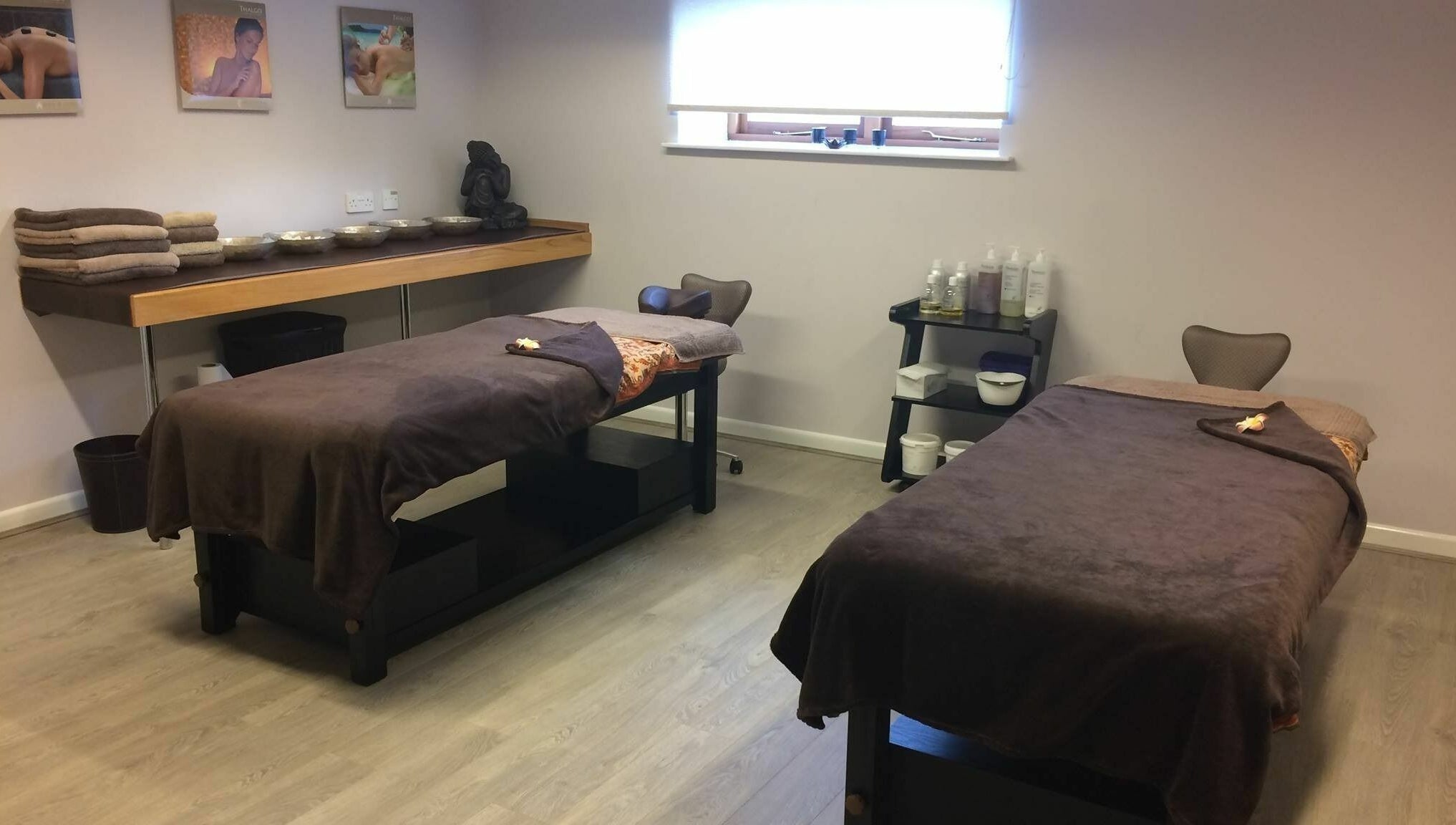 Luxurious massage room at Lotus Spa and Academy Centre, Abbotskerswell, England, GB with two massage tables.