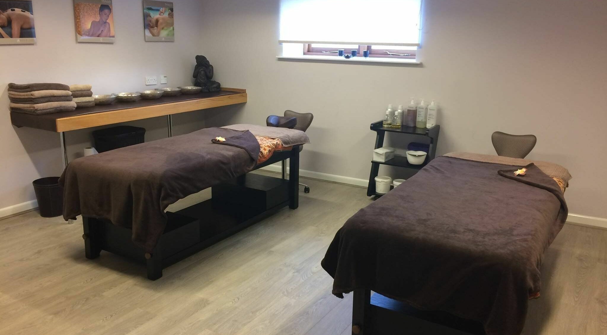 Luxurious massage room at Lotus Spa and Academy Centre, Abbotskerswell, England, GB with two massage tables.