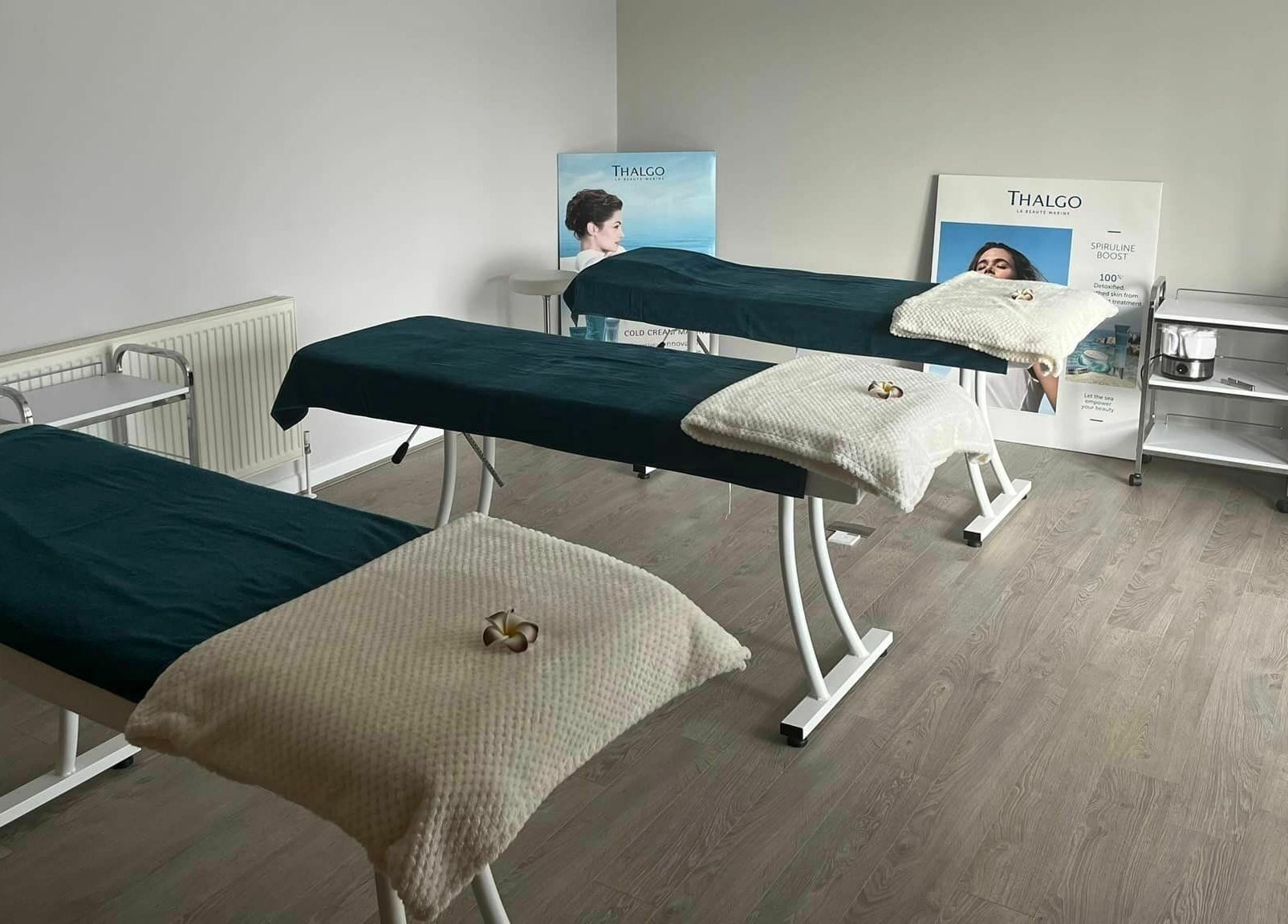 Treatment beds in a serene room at Lotus Spa and Academy Centre, Abbotskerswell, England, GB.
