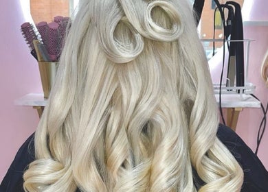 Stylish blonde curls styled at The Doll House York in York, England, GB.