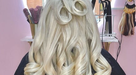 Stylish blonde curls styled at The Doll House York in York, England, GB.