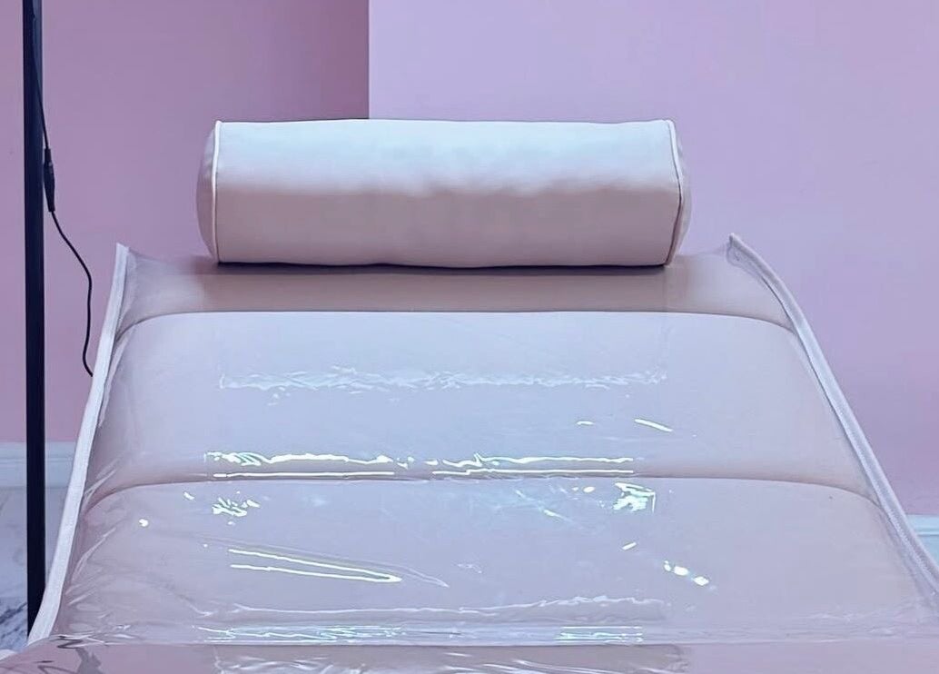 Relaxing massage table at The Doll House York, York, England, GB in a calming pink setting.