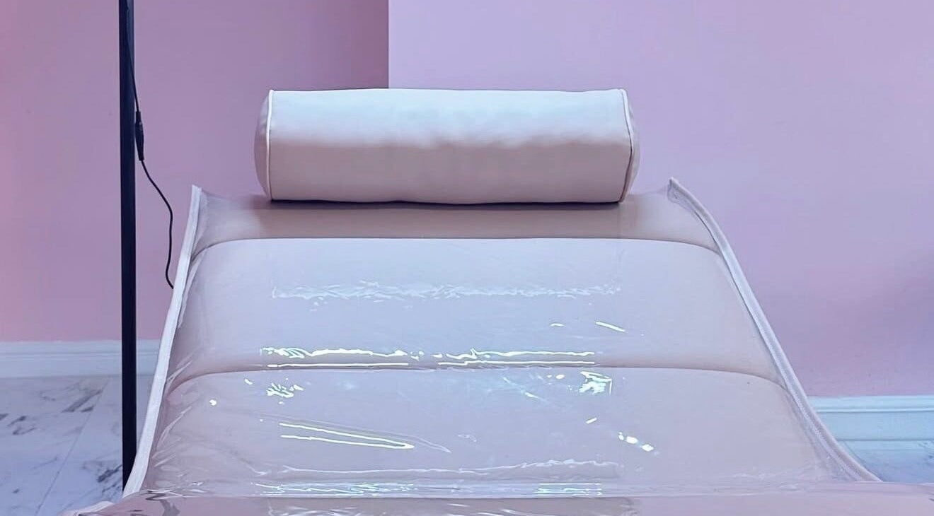 Relaxing massage table at The Doll House York, York, England, GB in a calming pink setting.