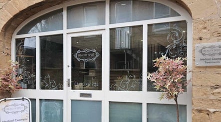 Entrance of New Moon Holistic Therapies in Mansfield, England, GB featuring decorative glass panels.