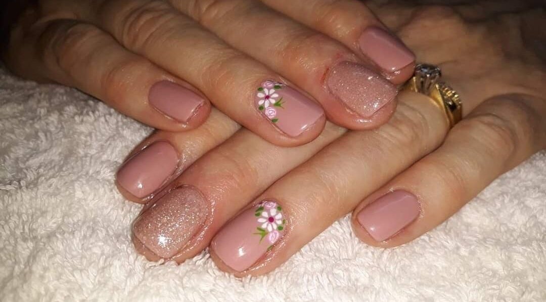 Stylish floral nail art on manicured nails at Janine Minnaar, Bothaville, Free State, ZA.