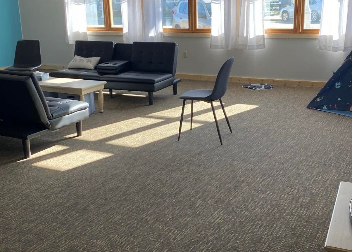 Inviting lounge area with comfy seating at Sheboygan Wellness Studio, Sheboygan, Wisconsin, US.