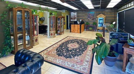 Chic interior of Vaughn Body Arts in Monterey, California, US with stylish decor and plants.