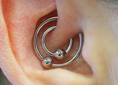 Close-up of a stylish ear piercing at Vaughn Body Arts in Monterey, California, US.