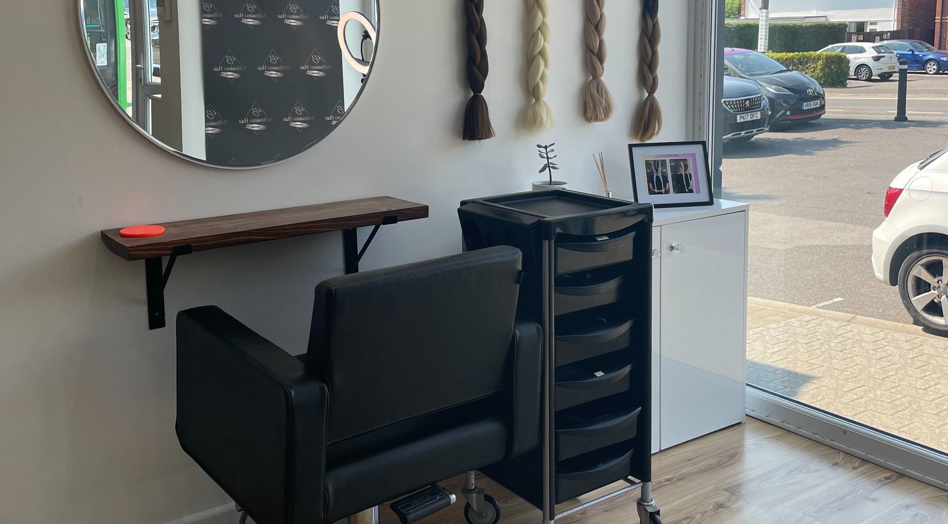 Elegant styling station at Bellissimo Hair, Denmead, England, GB, showcasing modern design and hair accessories.