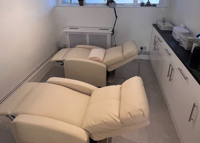 Relaxing treatment room at TLC Beauty Studio, Chichester, England, GB with plush recliner chairs for clients.