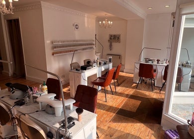 Elegant nail salon stations at TLC Beauty Studio, Chichester, England, GB, showcasing a polished and inviting space.