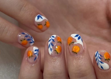 Bright citrus-themed nail art at TLC Beauty Studio in Chichester, England, GB.