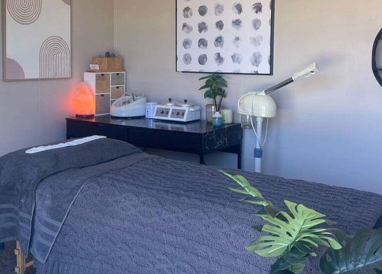 The Littlest Beauty Studio's serene treatment space in Auckland, Auckland, NZ, featuring a massage bed and calming decor.
