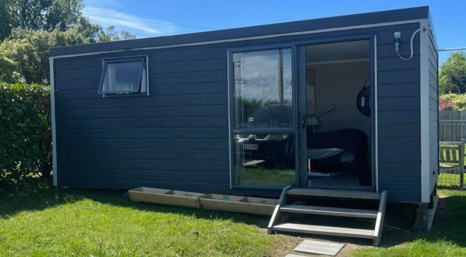 Exterior view of The Littlest Beauty Studio, a modern gray building in Auckland, Auckland, NZ.