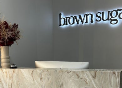 Reception desk with floral decor at Brown Sugar Rozelle, Rozelle, New South Wales, AU.