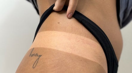 Visible tan lines highlight skin at Brown Sugar Rozelle, Rozelle, New South Wales, AU.