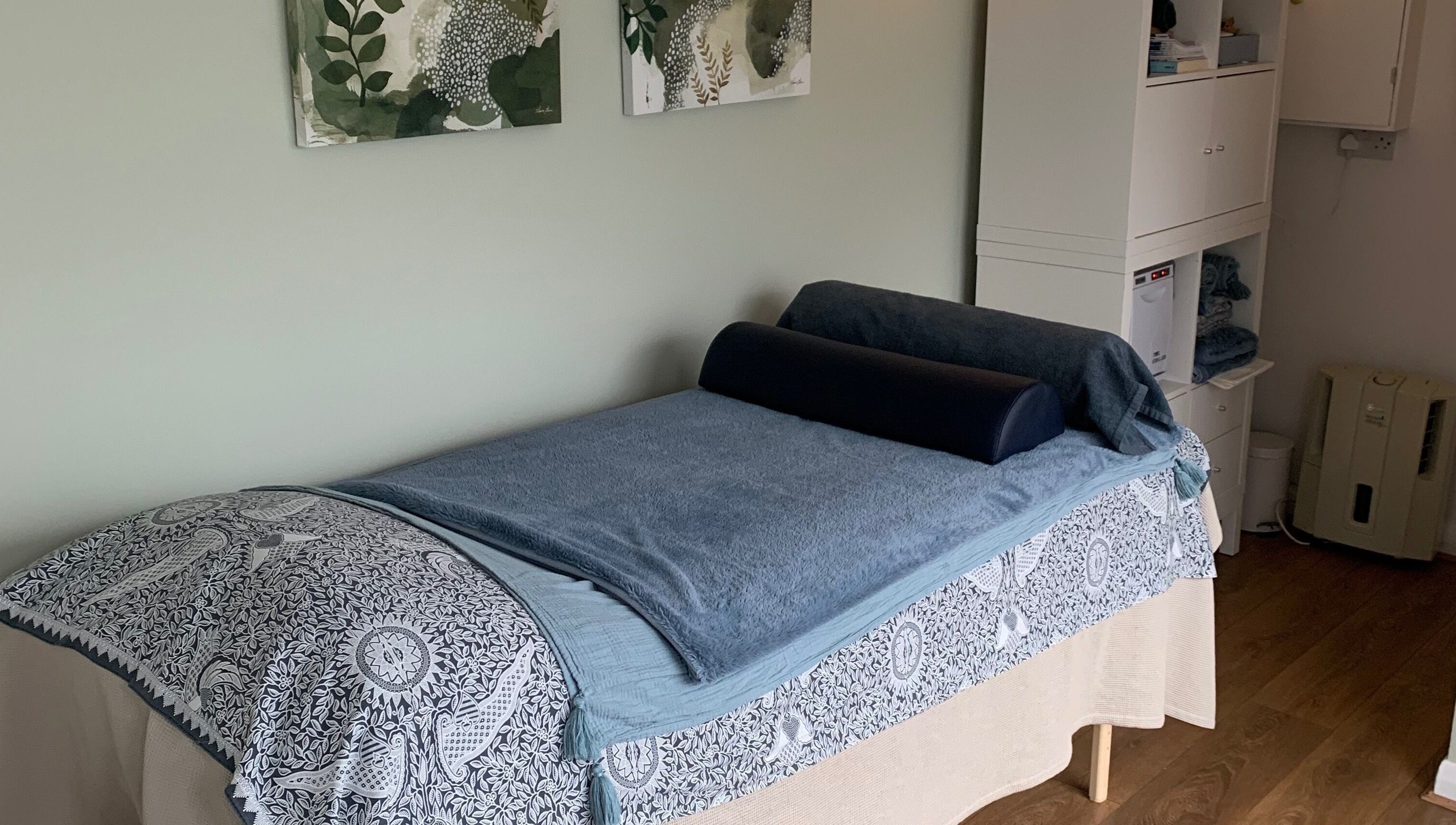 Calm therapy room at Tonic Reflexology, Derby, England, GB with a massage bed and soothing decor.