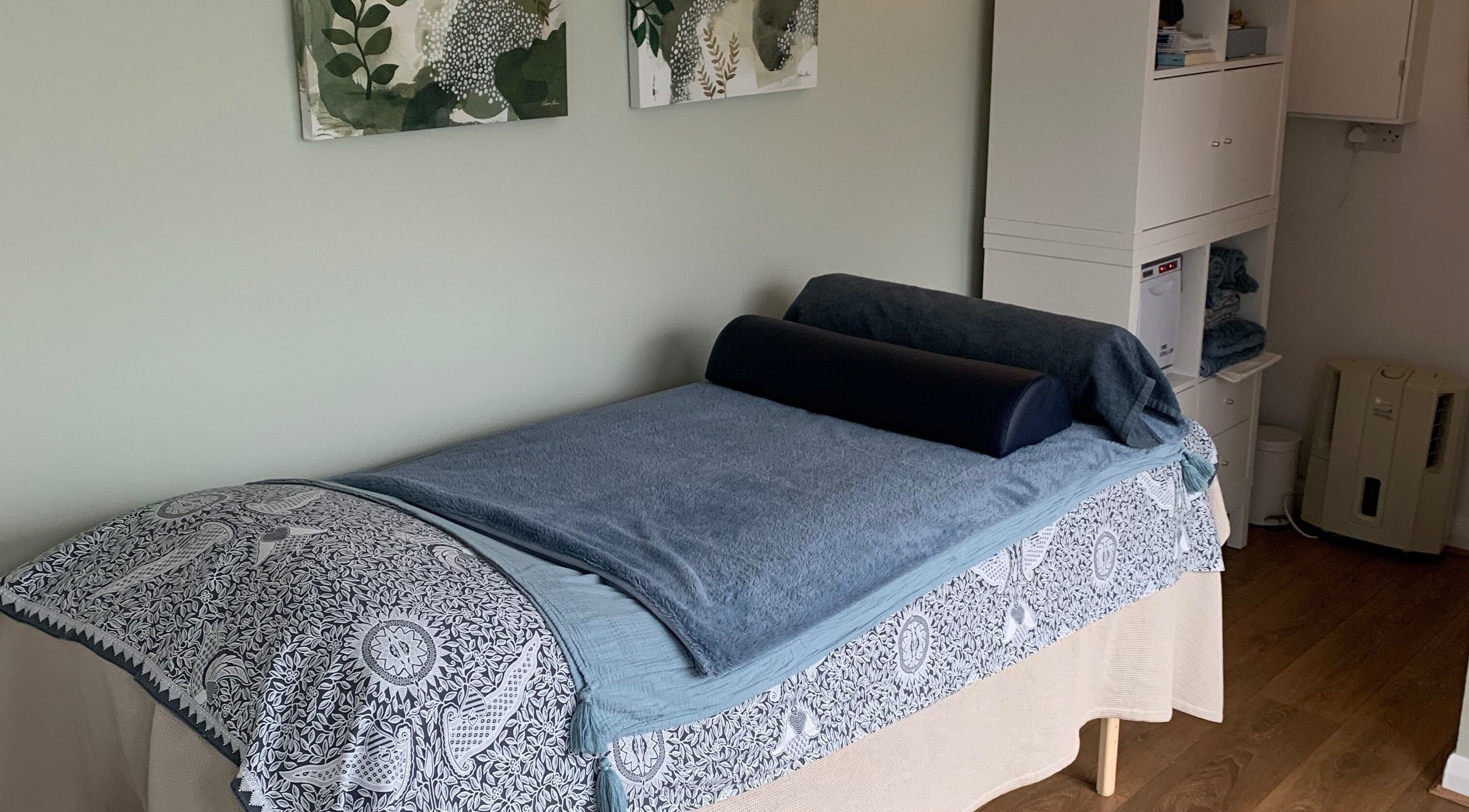 Calm therapy room at Tonic Reflexology, Derby, England, GB with a massage bed and soothing decor.