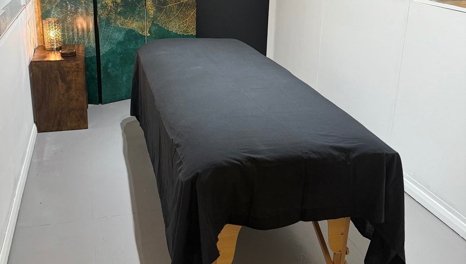 Relaxing massage table at Indigo Massage at 3M Fitness, Nettlestead, GB, offering tranquil spa ambiance.