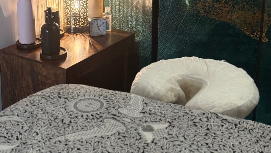 Tranquil massage room at Indigo Massage at 3M Fitness, Nettlestead, GB, featuring a cozy treatment bed.