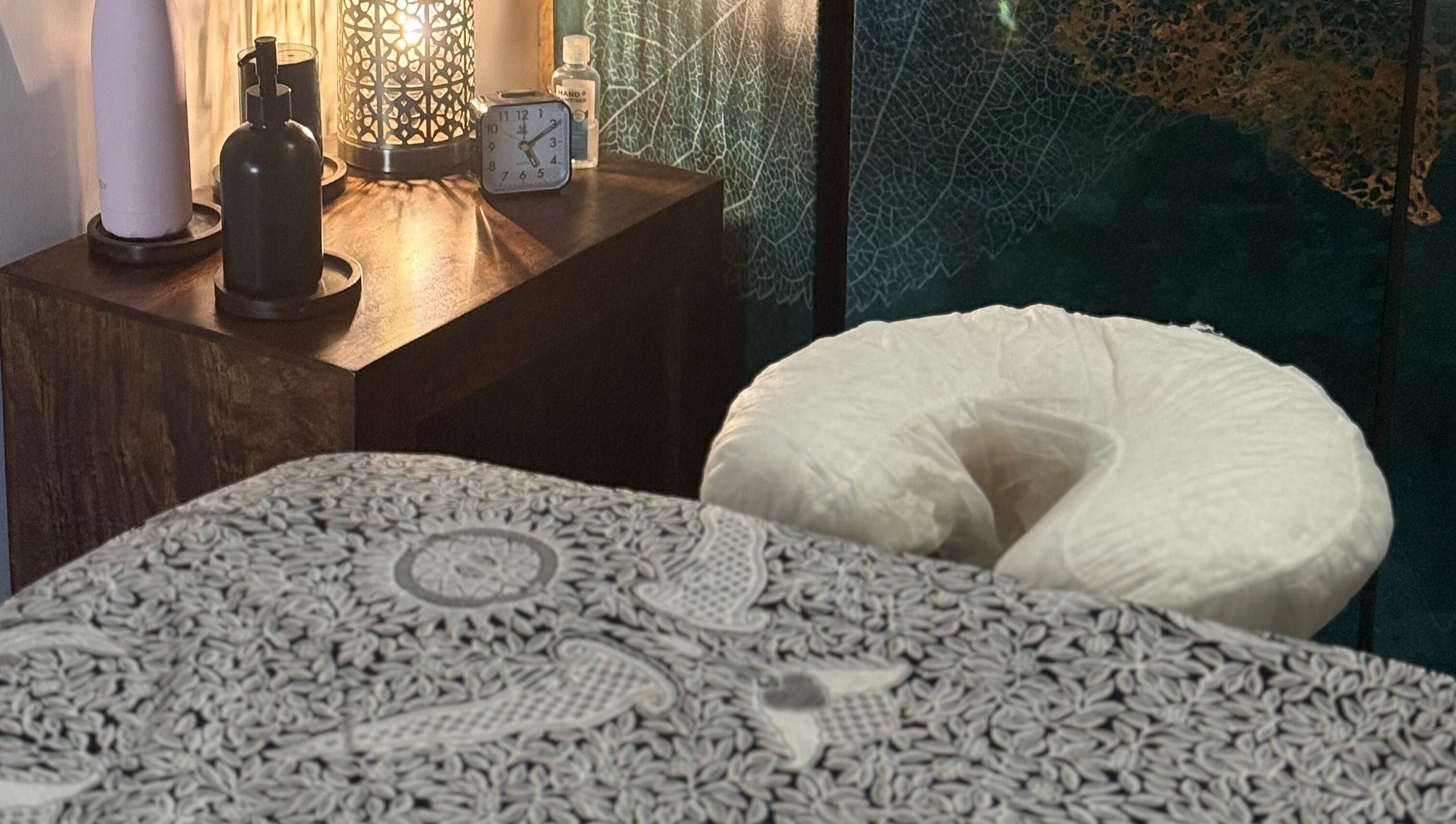 Relaxing massage room at Indigo Massage inside 3M Fitness, Nettlestead, GB with elegant decor and soft lighting.