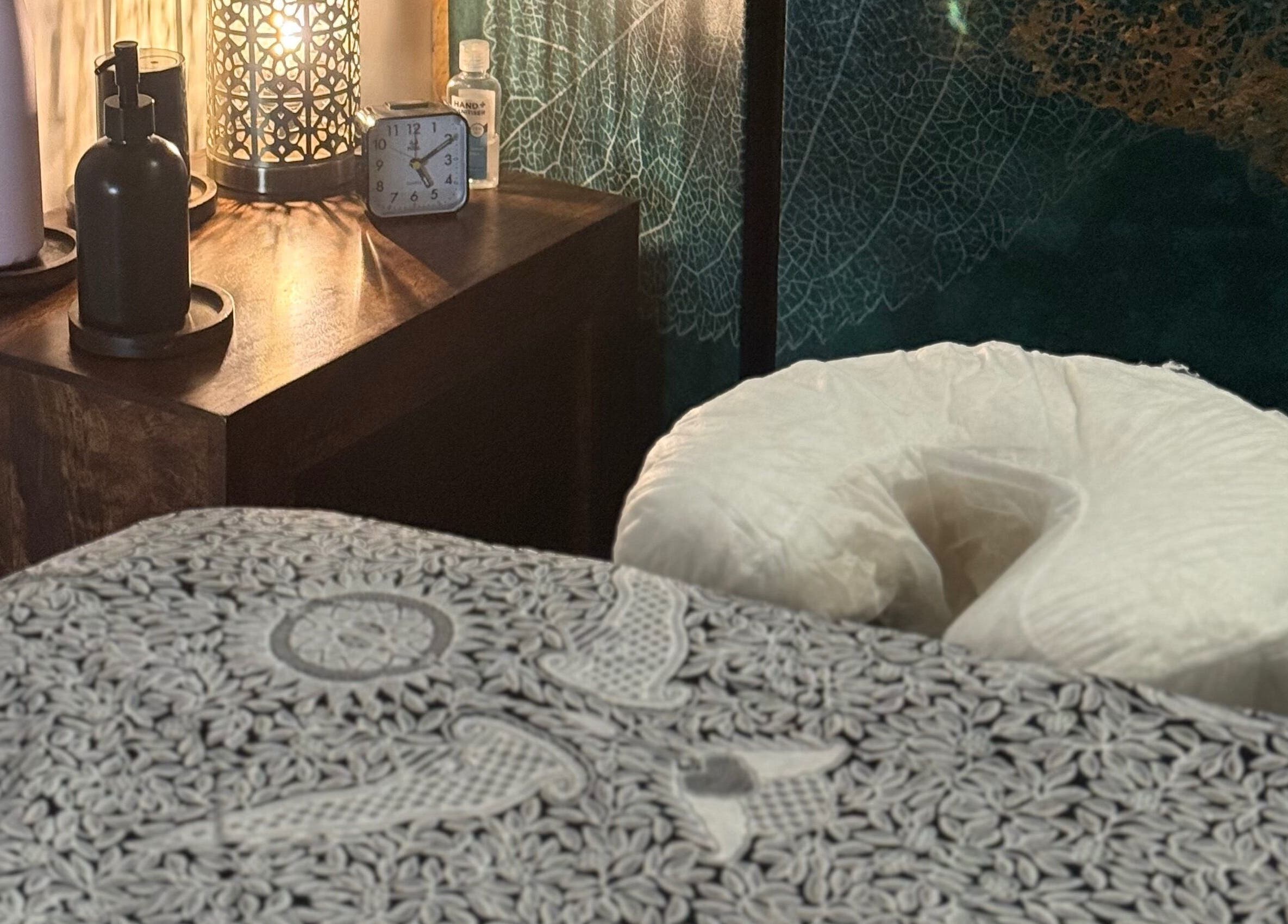 Relaxing massage room at Indigo Massage inside 3M Fitness, Nettlestead, GB with elegant decor and soft lighting.