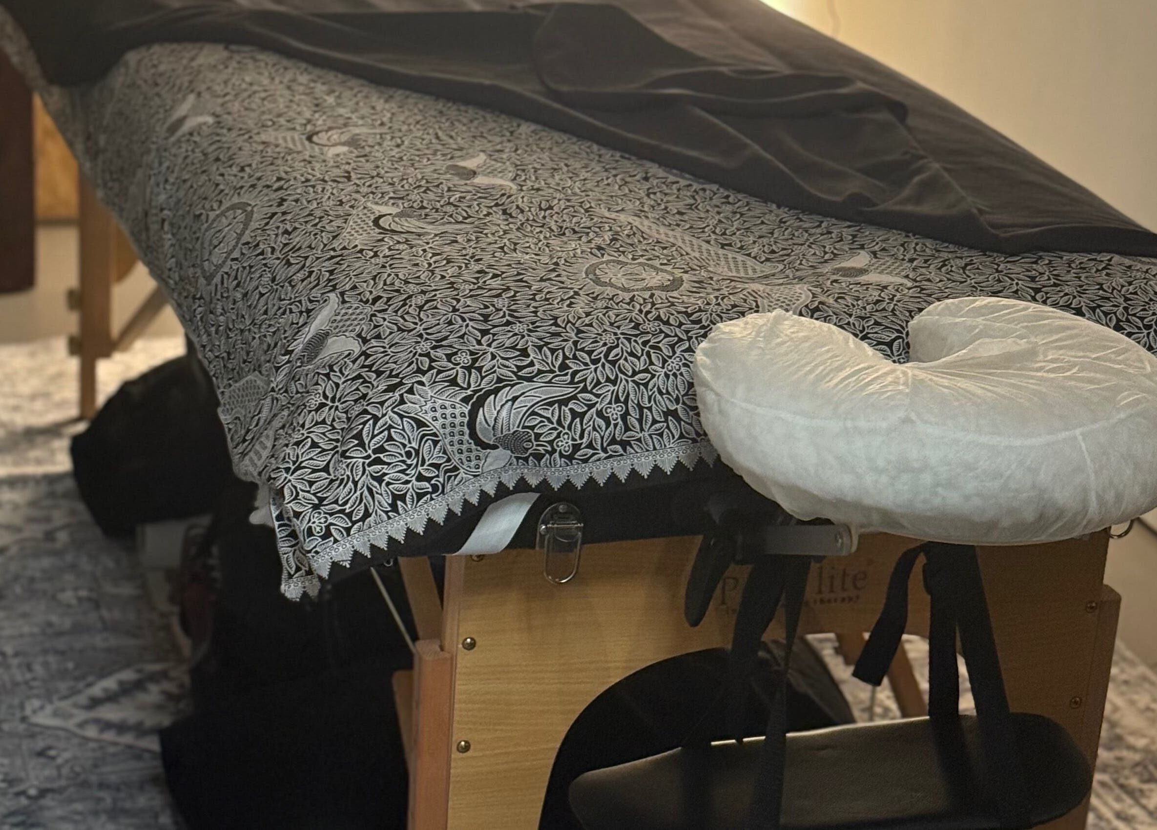 Massage table setup at Indigo Massage at 3M Fitness in Nettlestead, GB, ready for relaxation.