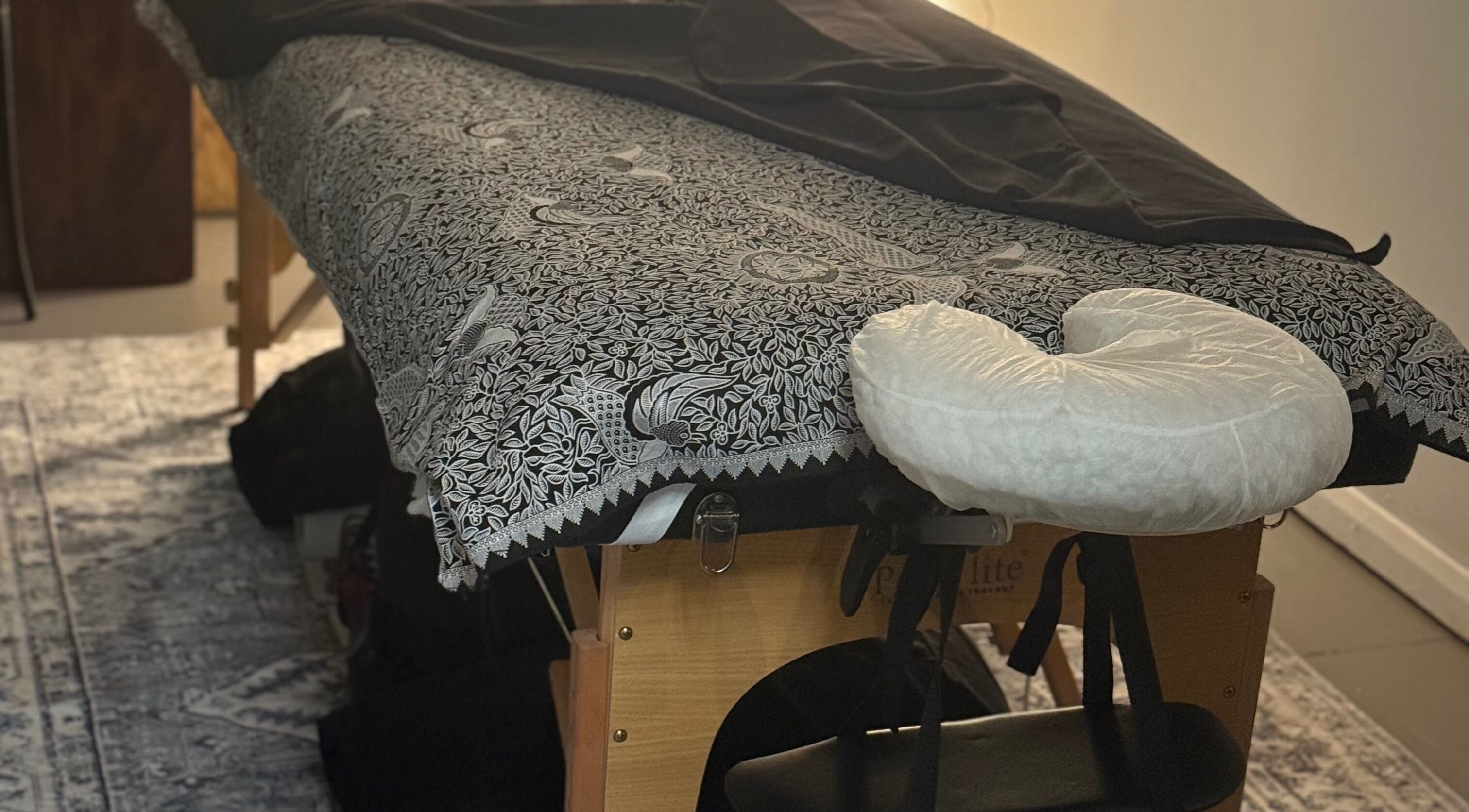 Massage table setup at Indigo Massage at 3M Fitness in Nettlestead, GB, ready for relaxation.