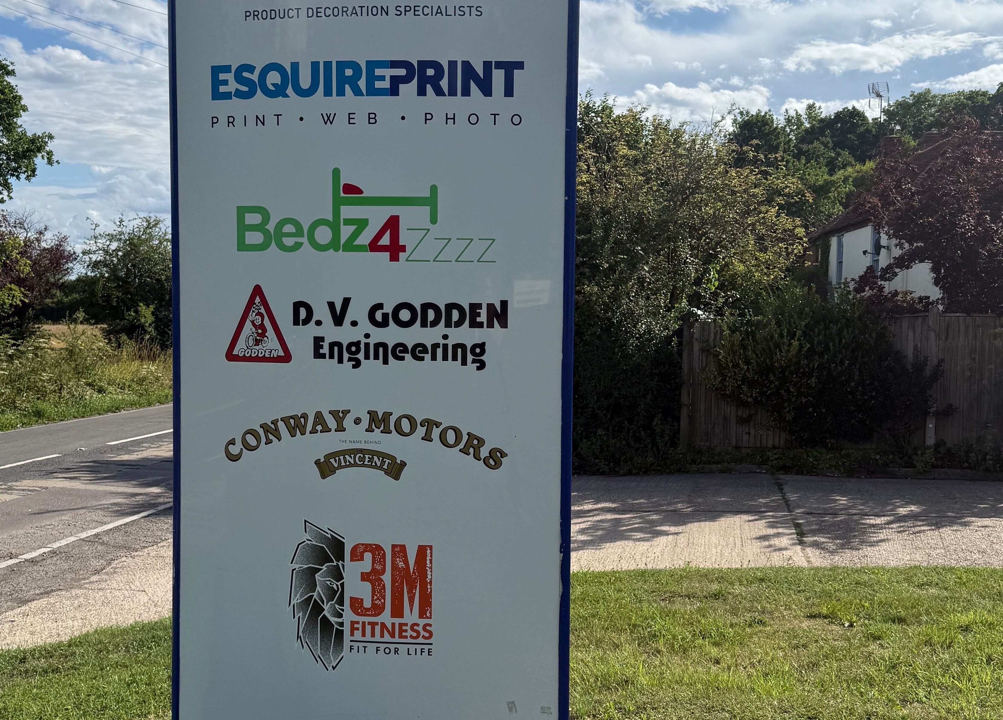 Sign outside Indigo Massage at 3M Fitness, Nettlestead, GB with various business names.