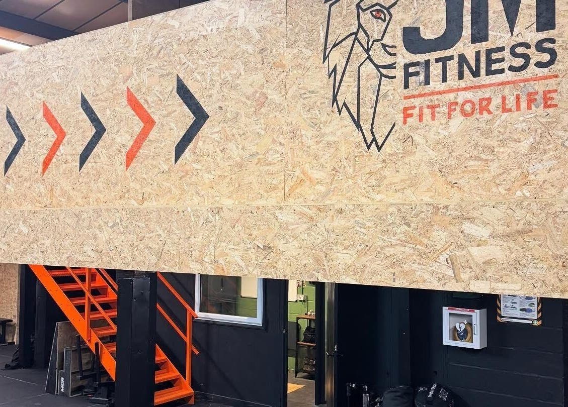 Interior view of Indigo Massage at 3M Fitness, Nettlestead, GB, showcasing modern design with logo signage.