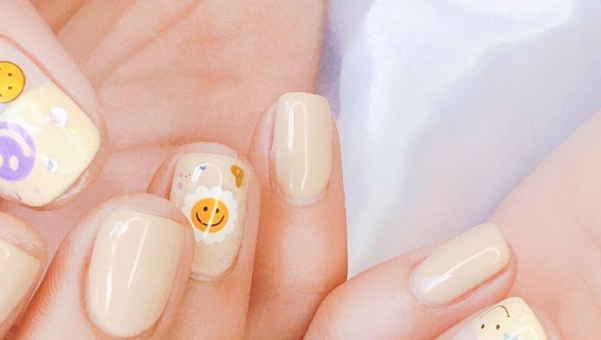 Close-up of whimsical smiley nail art at Wonderbu Nails, Melbourne, Victoria, AU.