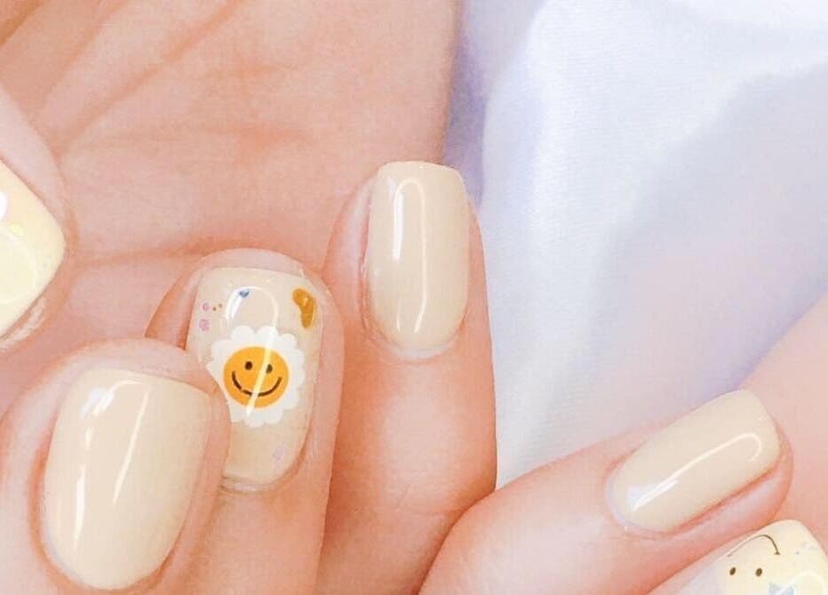 Close-up of whimsical smiley nail art at Wonderbu Nails, Melbourne, Victoria, AU.
