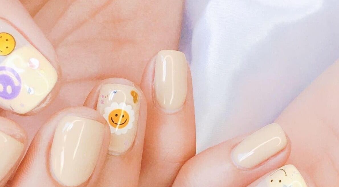 Close-up of whimsical smiley nail art at Wonderbu Nails, Melbourne, Victoria, AU.