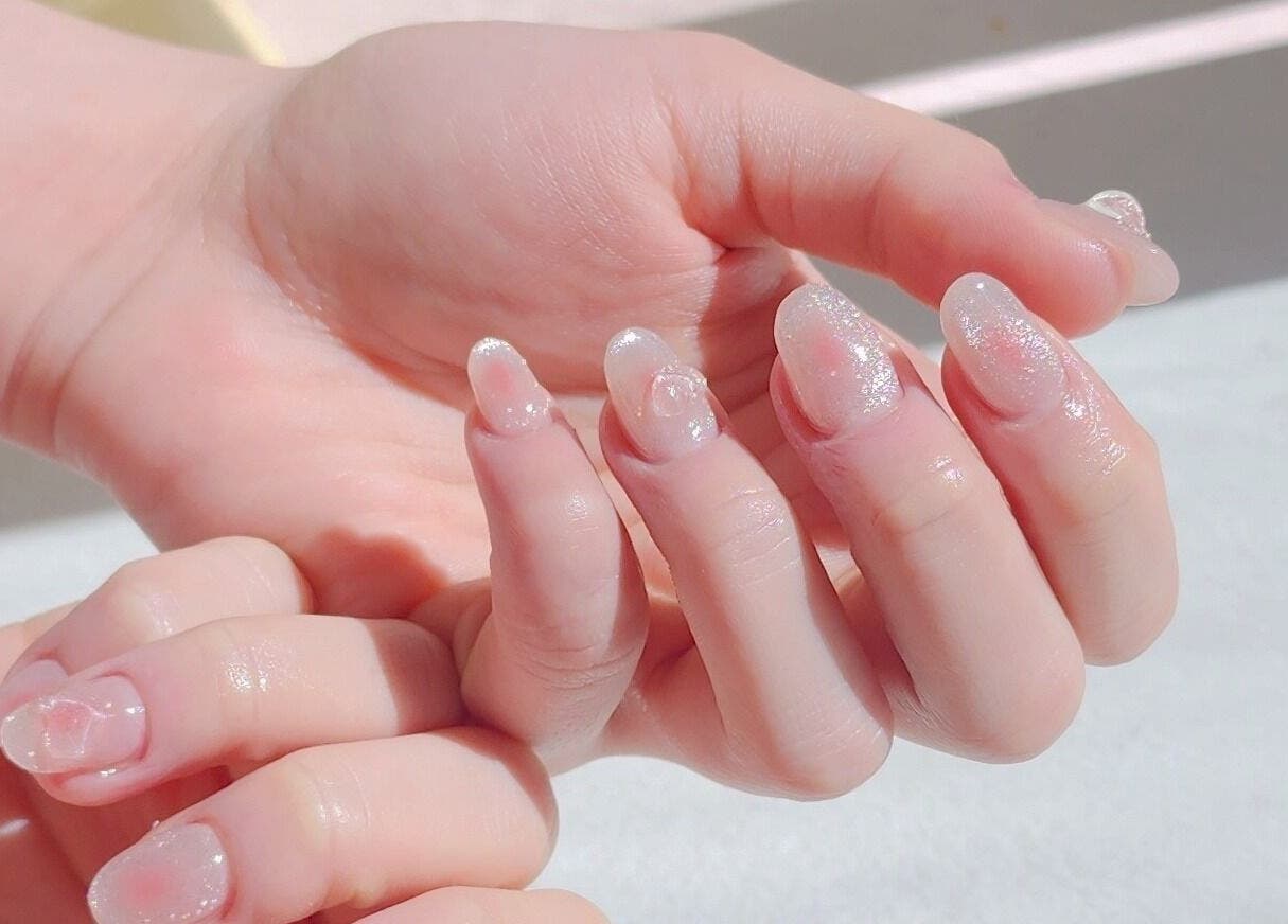 Elegant glitter nails at Wonderbu Nails, Melbourne, Victoria, AU, showcasing delicate artistry and shine.